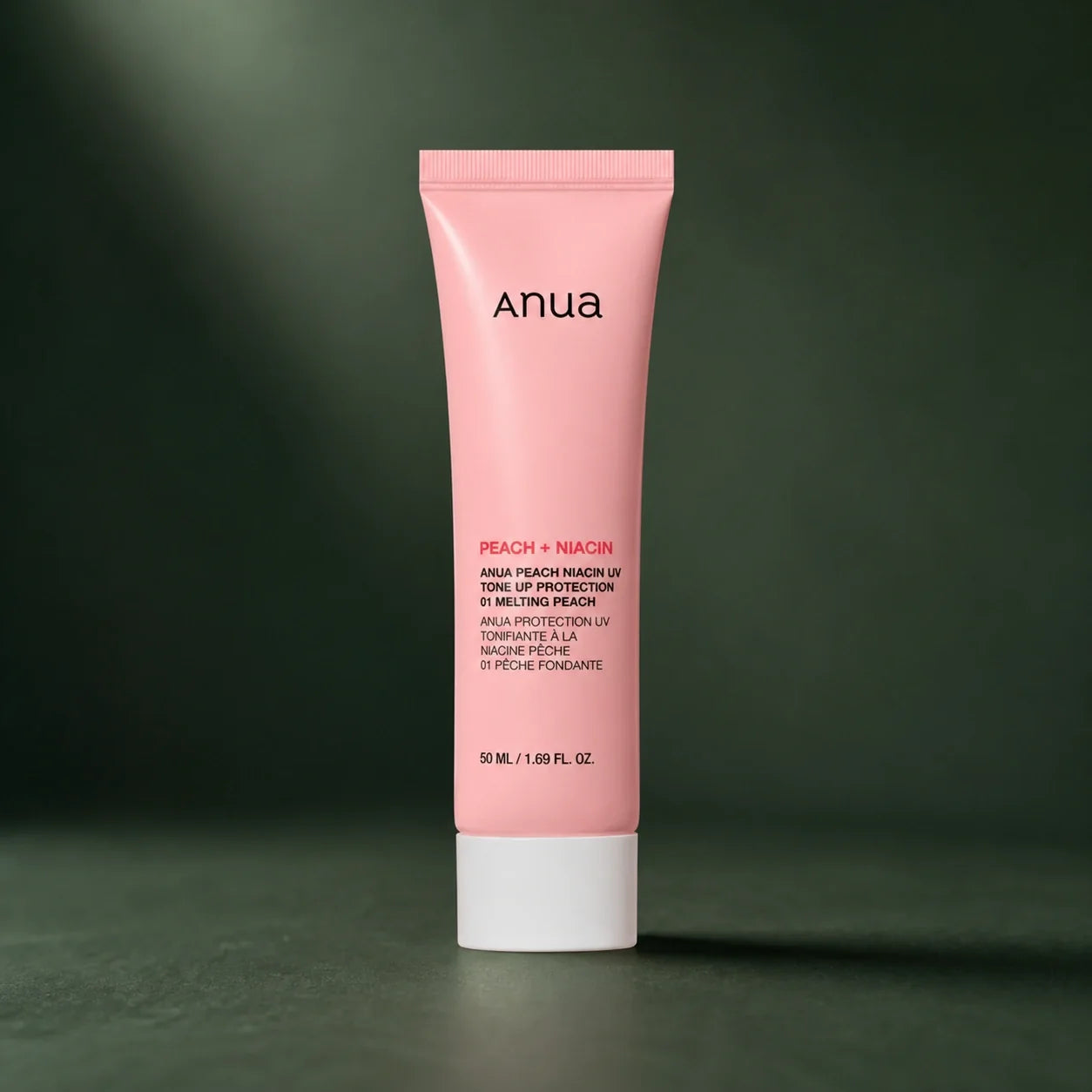 ANUA Base Teintée Peach Niacin UV Tone Up 50 ml sur fond vert premium