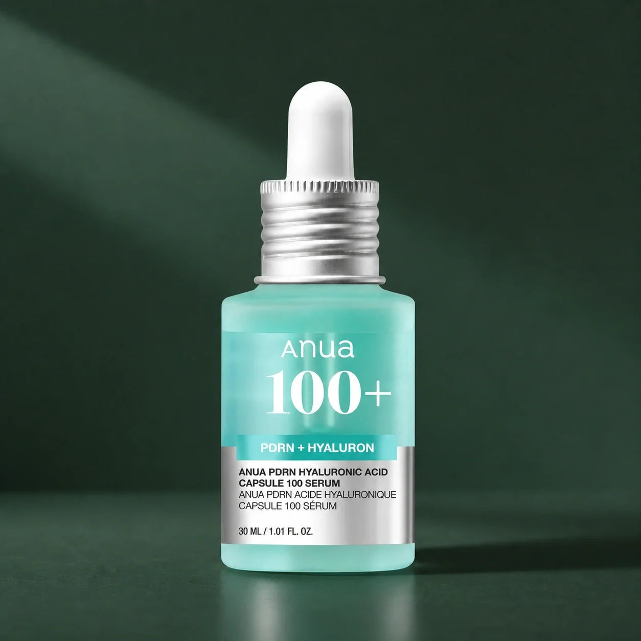 ANUA Sérum Capsule PDRN Acide Hyaluronique 100 30 ml sur fond vert premium
