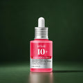 ANUA Sérum Niacinamide 10 % + TXA 4 % Anti-Taches 30 ml sur fond vert premium
