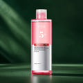 ANUA Toner Éclat Niacinamide TXA 250 ml sur fond vert premium