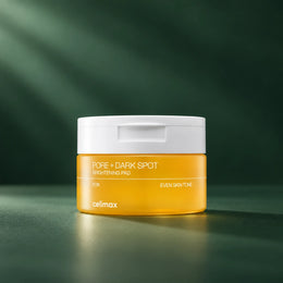 Pot celimax Pore+ Dark Spot Brightening Pad sur fond vert profond, 40 disques éclat