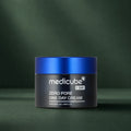 Crème Medicube Zero Pore One Day fermée sur fond vert profond