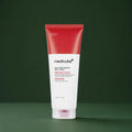 Lotion Corps Red Clear Capsule Medicube sur fond vert profond