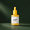 Sérum Medicube acide kojique curcuma niacinamide sur fond vert