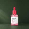 Sérum Medicube TXA Niacinamide 15 % en studio vert