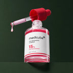 Flacon ouvert et pipette du sérum Medicube TXA Niacinamide