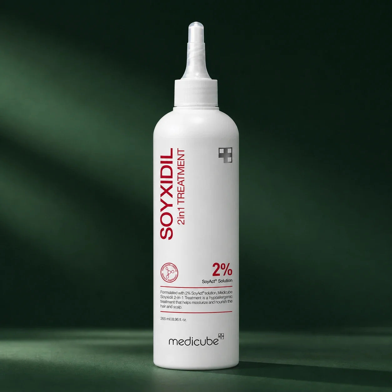 Medicube Soin 2-en-1 Soyxidil – flacon sur fond vert premium