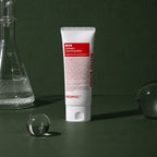 Baume Démaquillant Red Lacto Collagen MEDIPEEL – vue 3 sur fond vert profond.