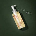 Huile Démaquillante Red Lacto Collagen 2.0 MEDIPEEL – vue 2 sur fond vert profond.