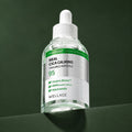 Ampoule Apaisante Cica 95 Anti-Imperfections WELLAGE sur fond vert profond