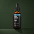 Ampoule Visage Botuleedle aux Peptides WELLAGE sur fond vert profond