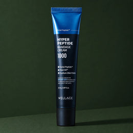 Crème Visage Bandage aux Peptides WELLAGE sur fond vert profond