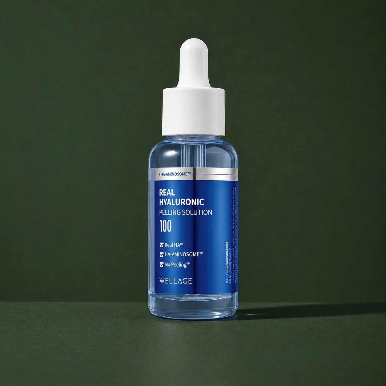 Solution Peeling Hyaluronique WELLAGE sur fond vert profond